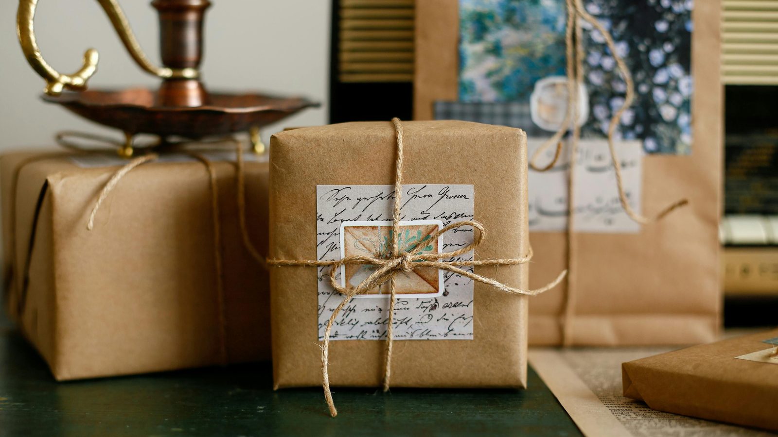 Kraft-paper wrapped gift parcels tied with twine, ready for gifting