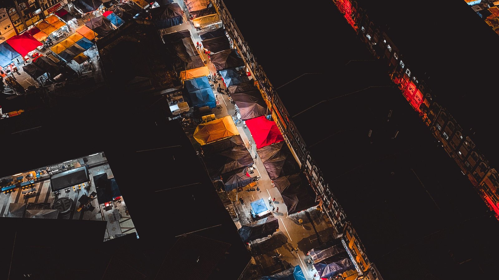 Aerial view of a colourful Malaysian night market, representing the everyday food culture Berkat Madinah Store serves